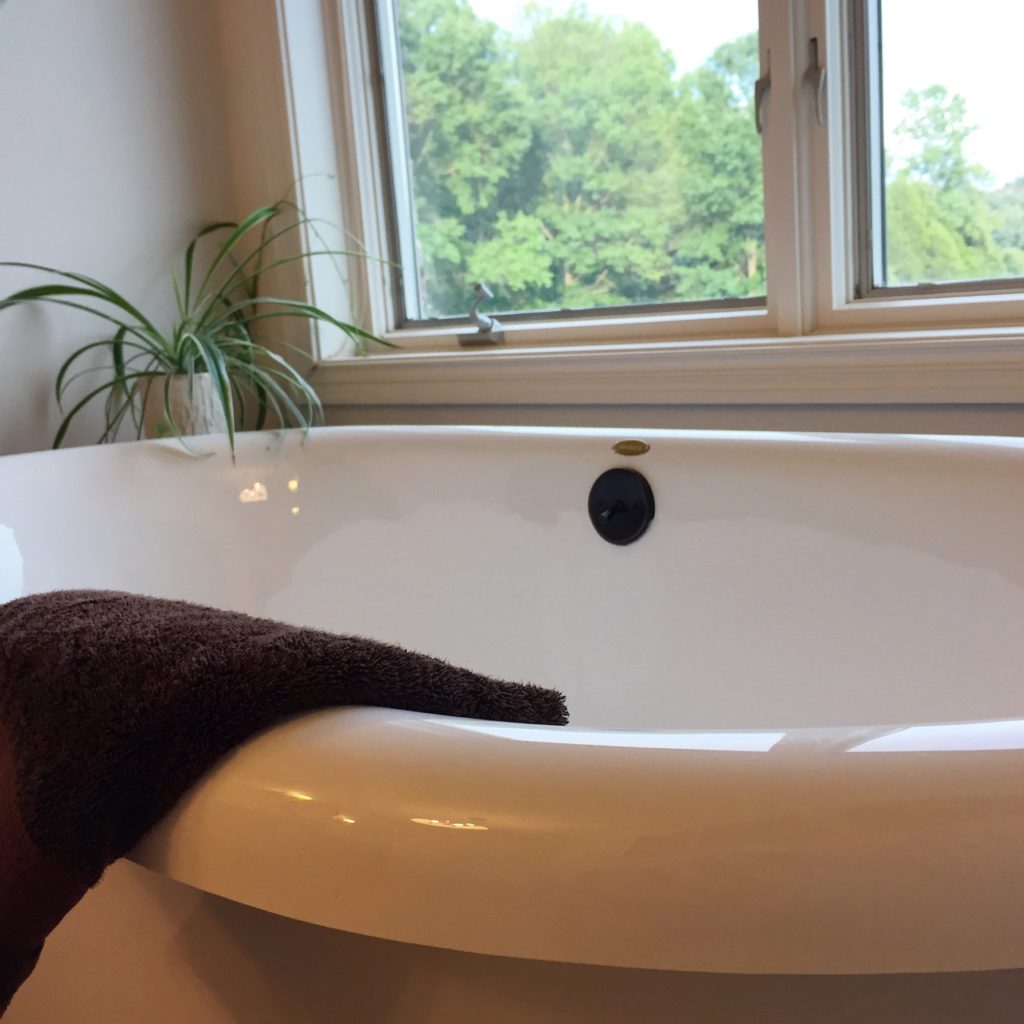 Free standing tub in updated bathroom