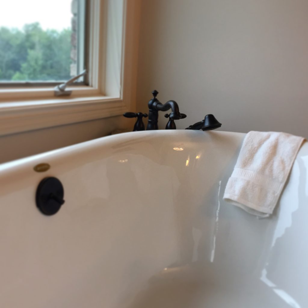 Free standing tub in updated bathroom