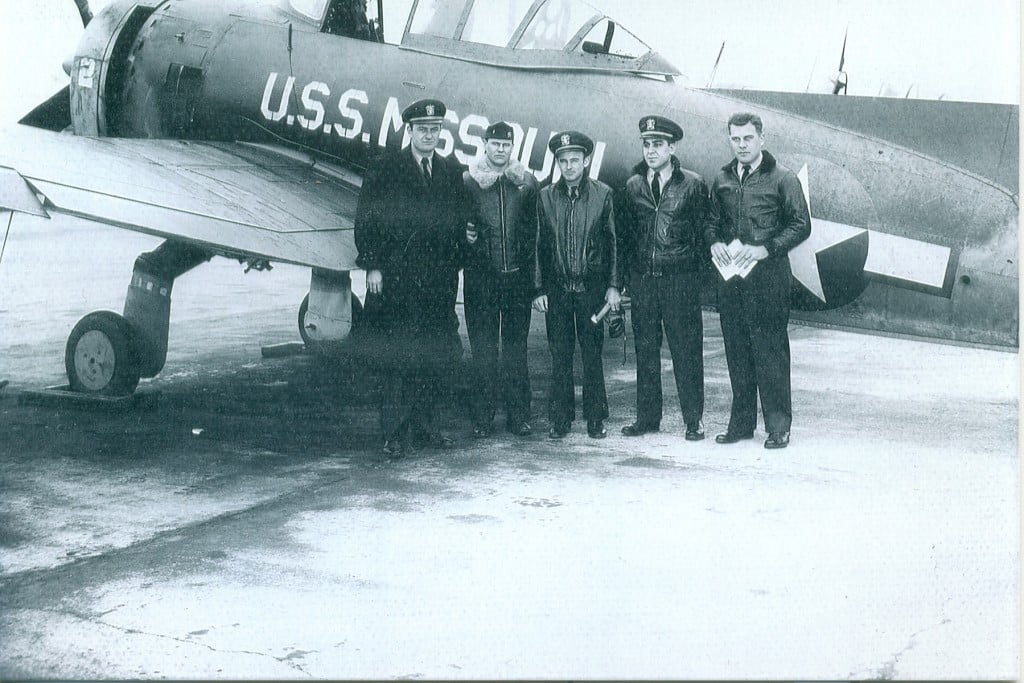 Henry Lohmeyer standing in front of his plane during World War II