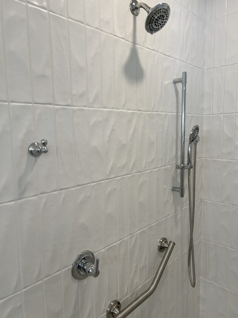 Walk-in shower installed during a bathroom remodel in Columbus, Indiana, featuring updated tile and modern fixtures.