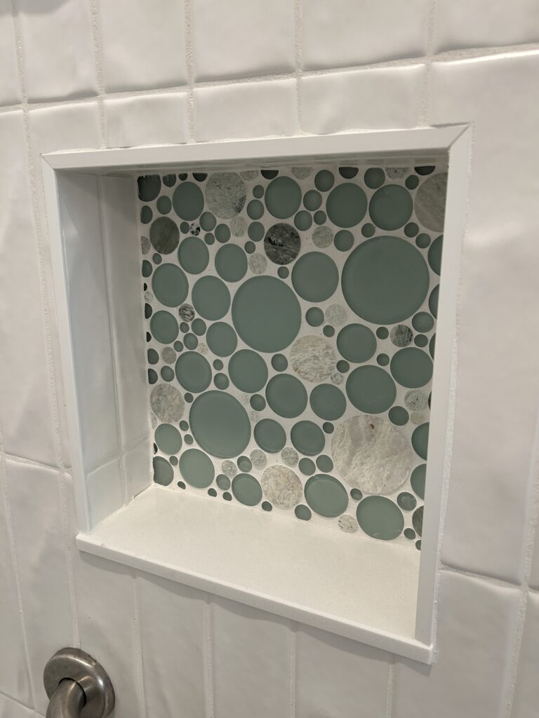 Close-up of tile work in a remodeled walk-in shower in Columbus, Indiana.